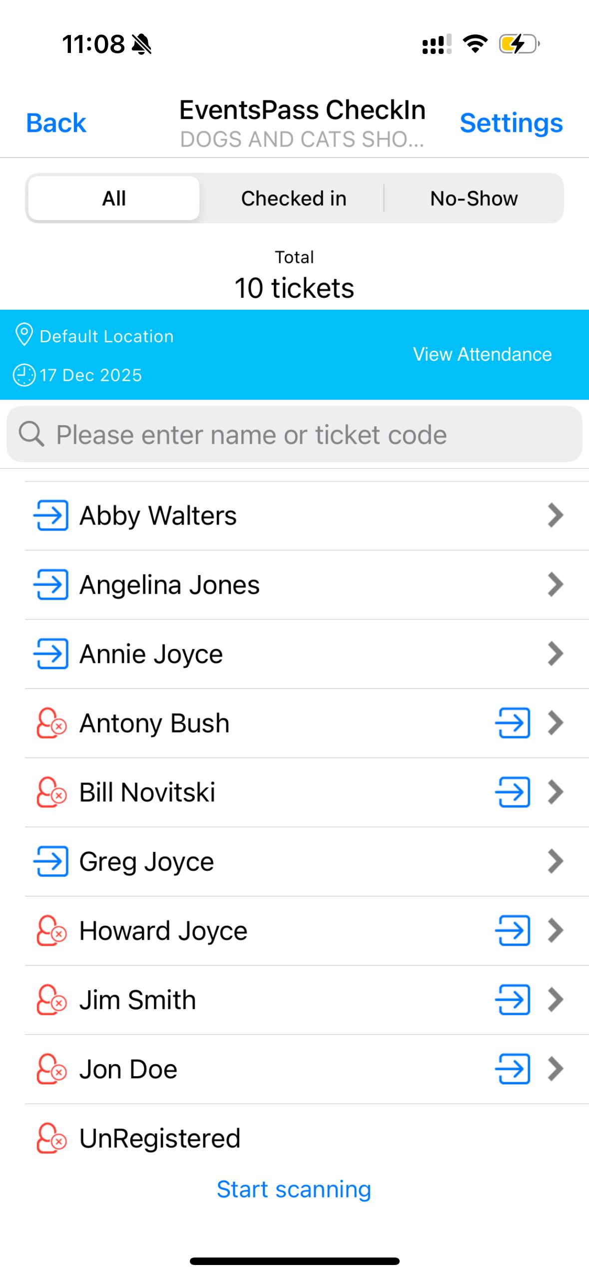 a hand holding a black device