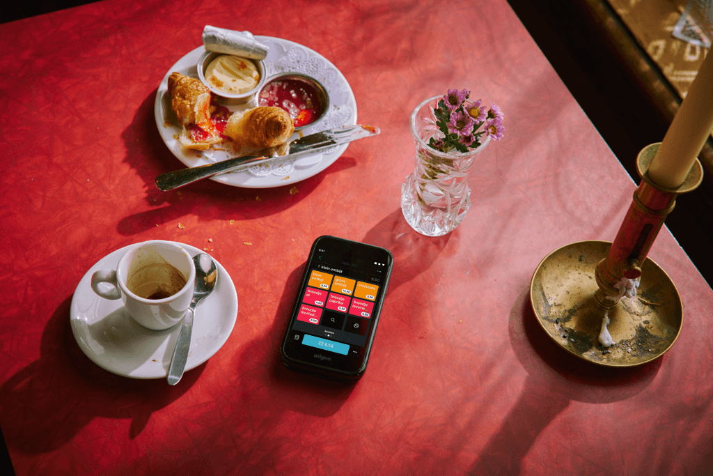 Tebi POS on a table with food