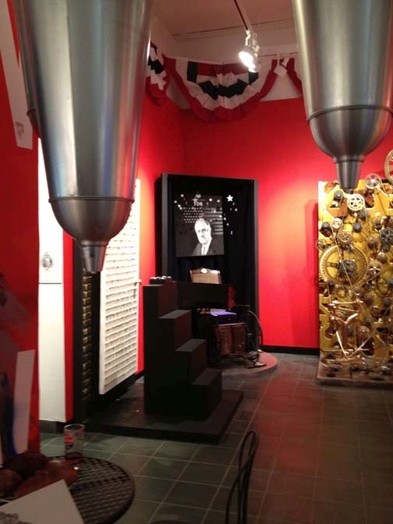 overview of the election exhibition with a black and white portrait in the corner of the room