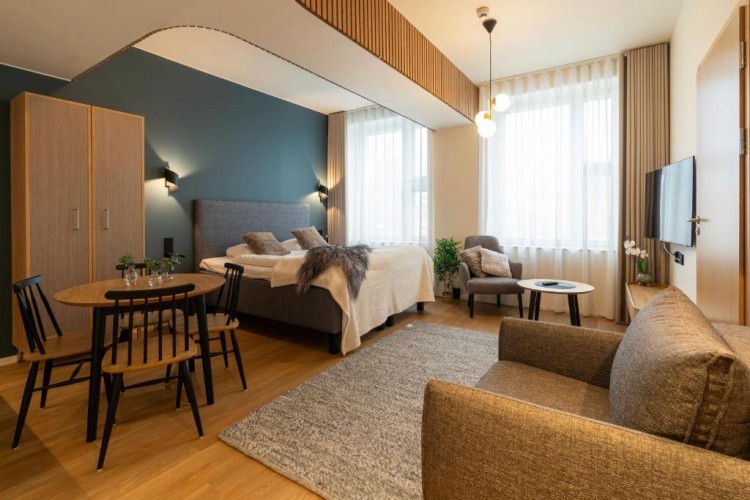 sunloungers fronting buildings near mountain