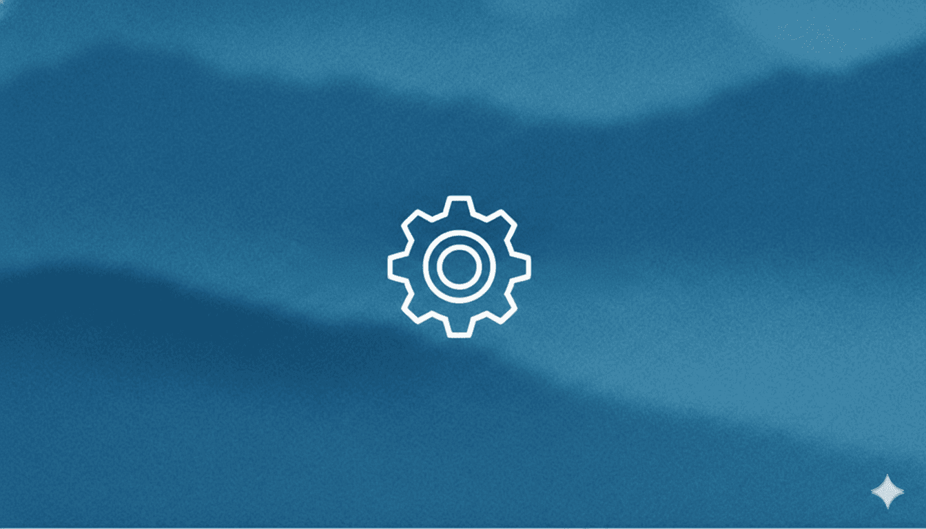 Smiling young man with short hair poses against a dark background, wearing a green button-up shirt.