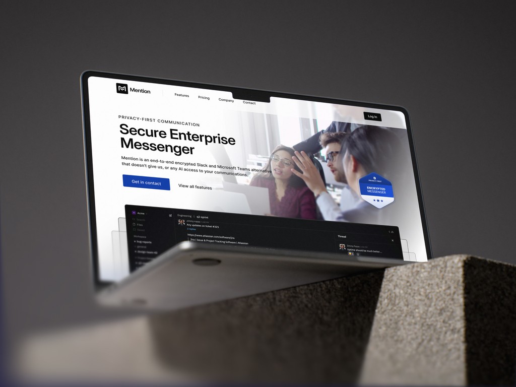 Laptop screen displaying Mention’s homepage UI with dark-themed team chat interface and privacy trust badge