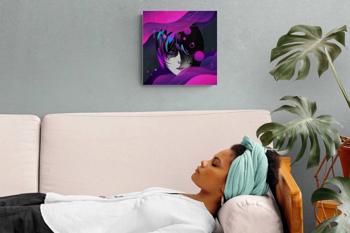 A woman resting on a couch in front art on the wall