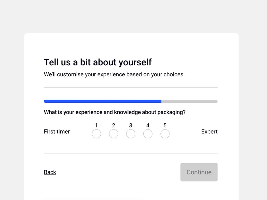 a cellphone leaning against a wall