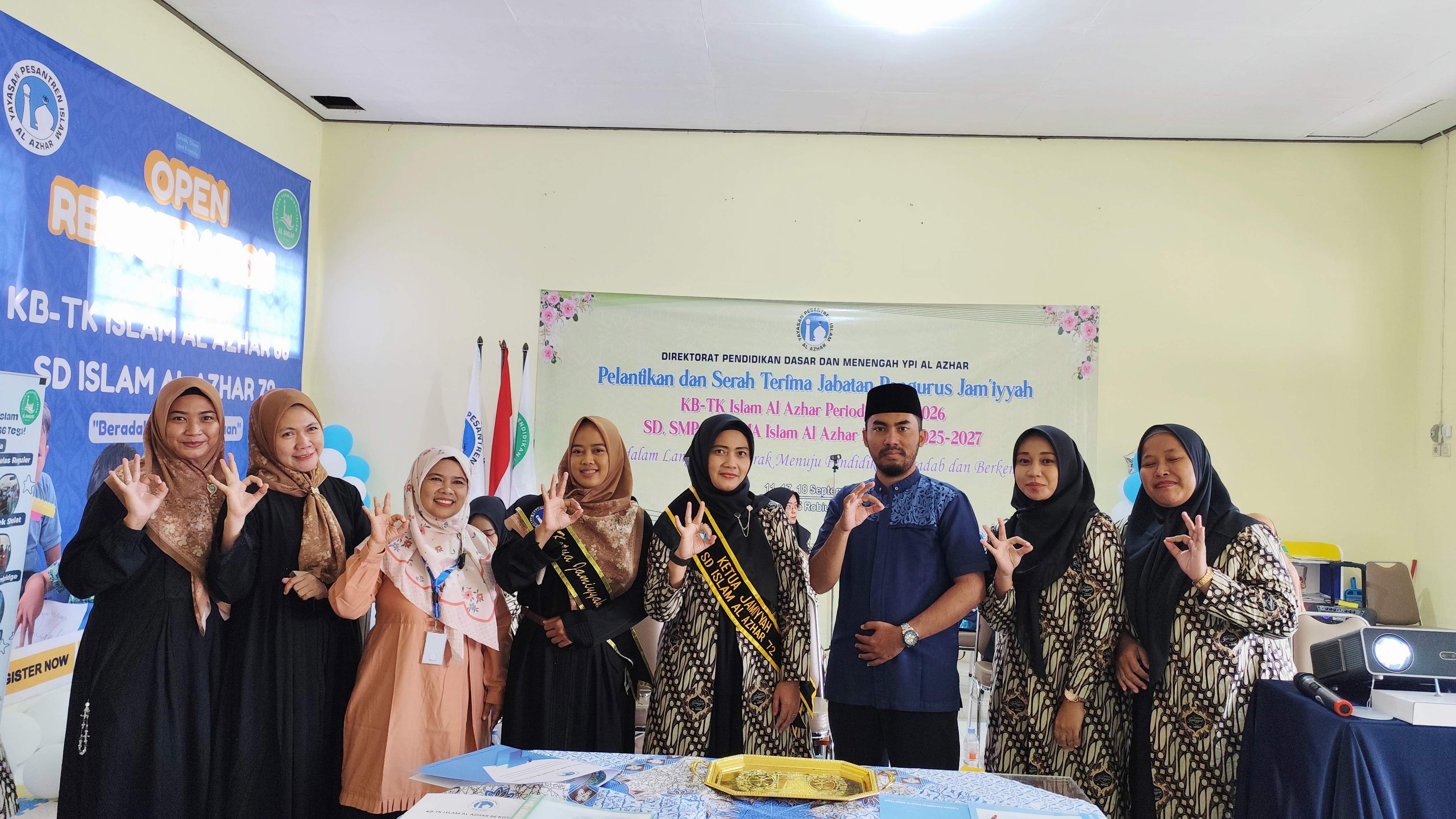 A group of people standing in a circle with their hands together