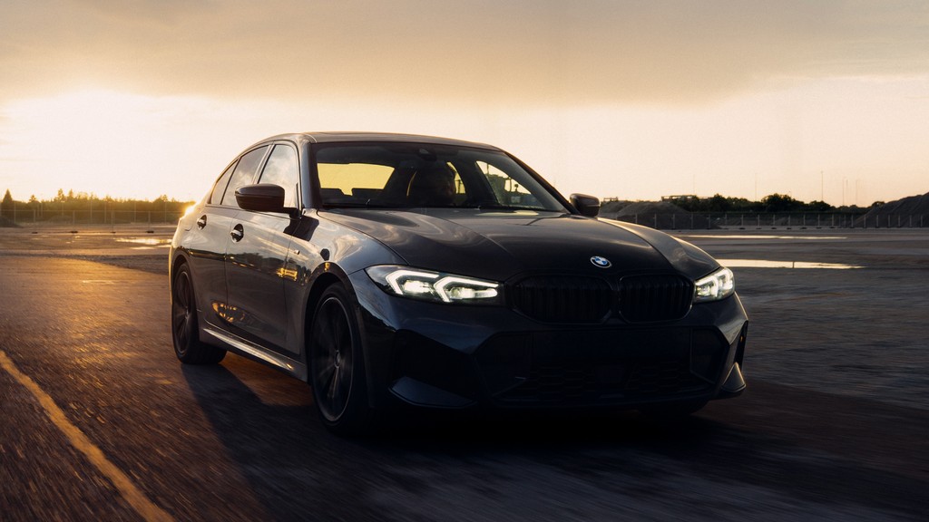 Rolling shot of a black BMW G20