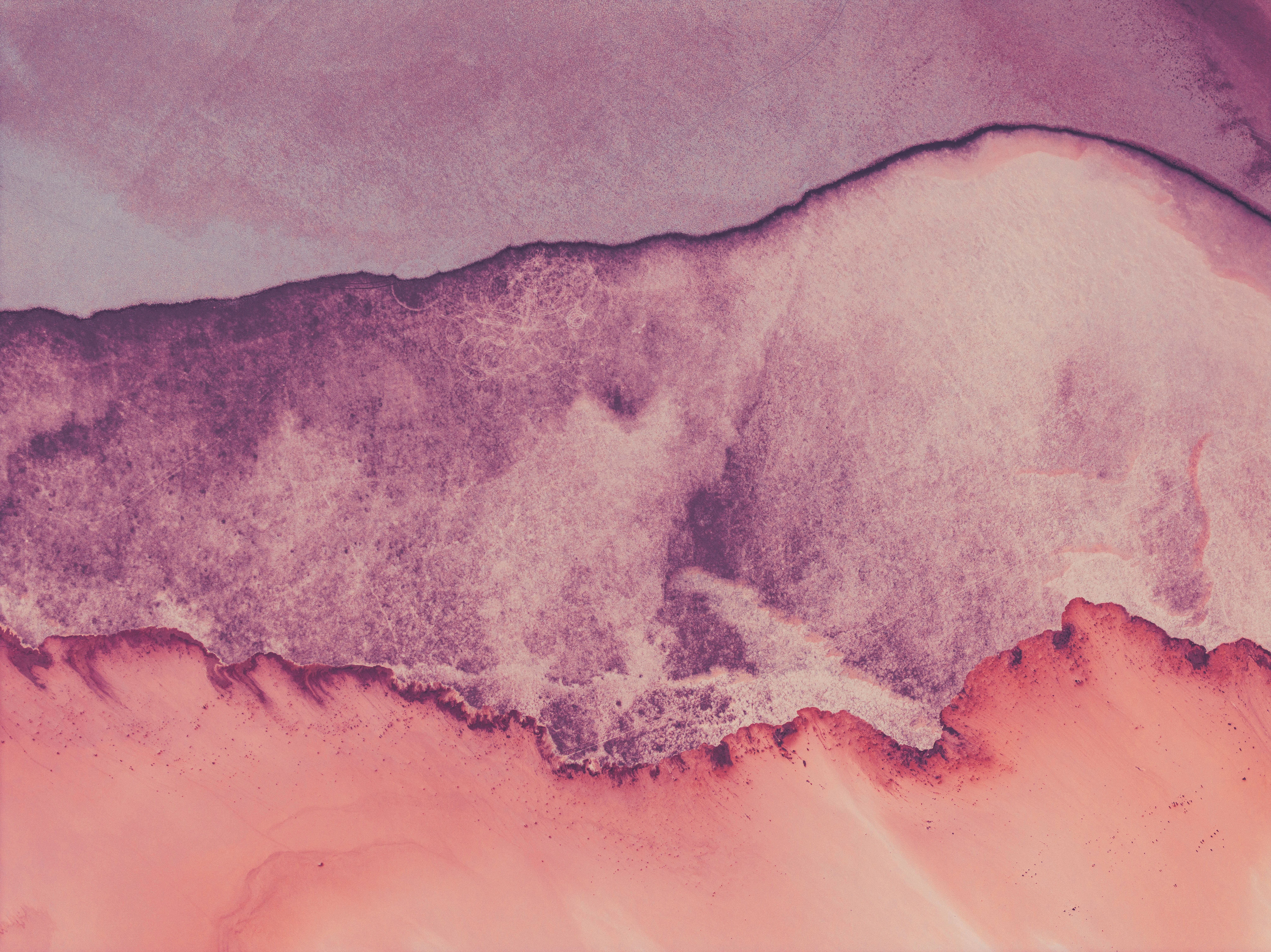 Abstract watercolor painting with pink and purple hues