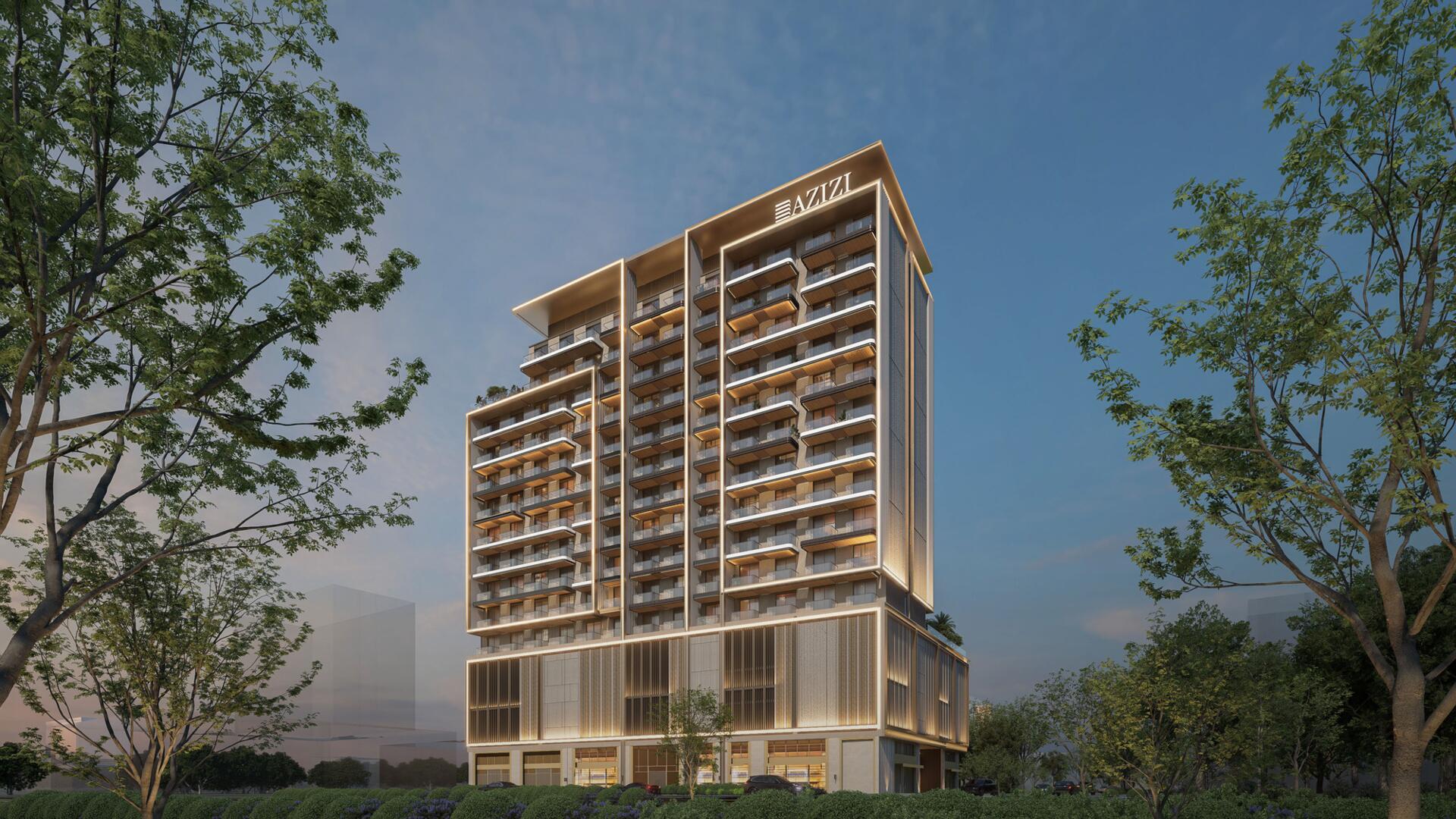 Modern Azizi Gabriel tower featuring numerous balconies on its sleek facade.