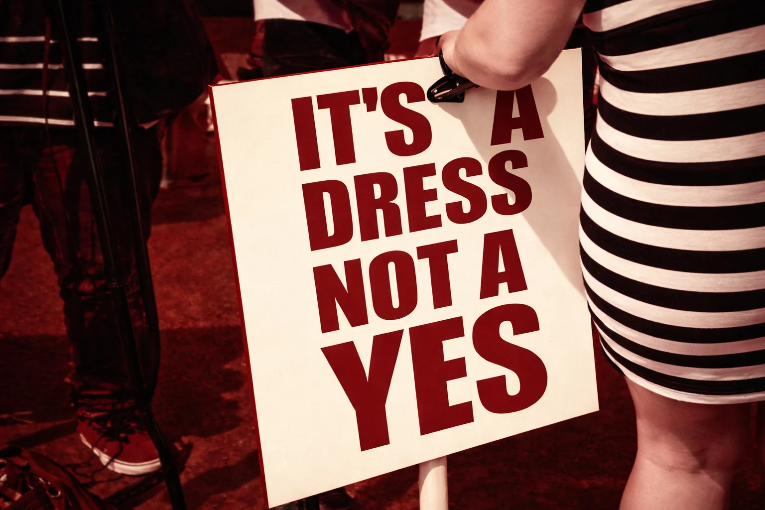 Protest sign: "It's a dress, not a yes."