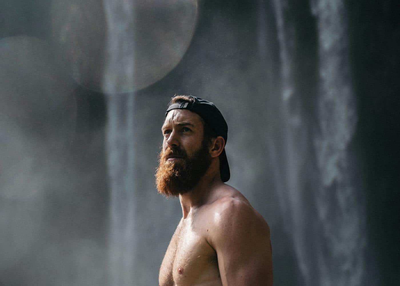 Beard growth supplements - Man with large beard looking off camera