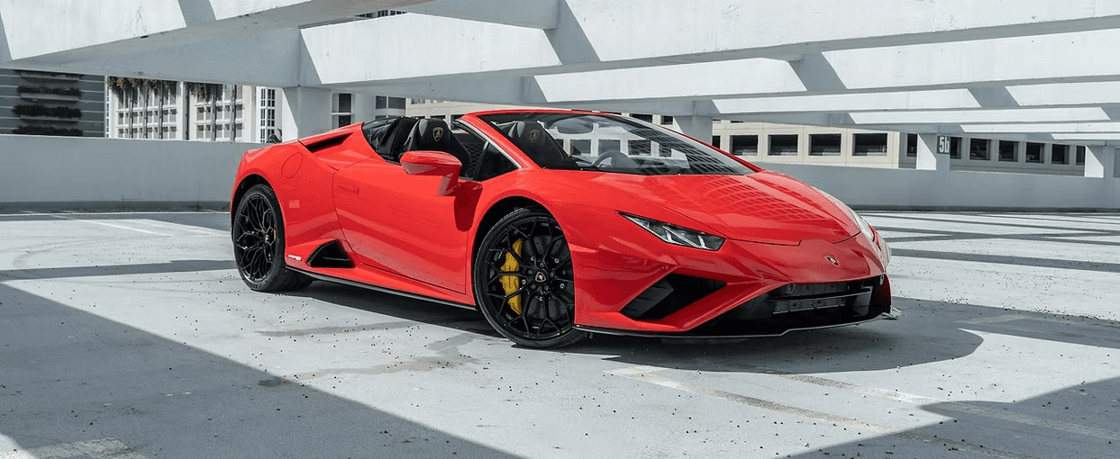 Two happy men driving a sportscar with a joyful expression, ideal for car rental adventure promotions.