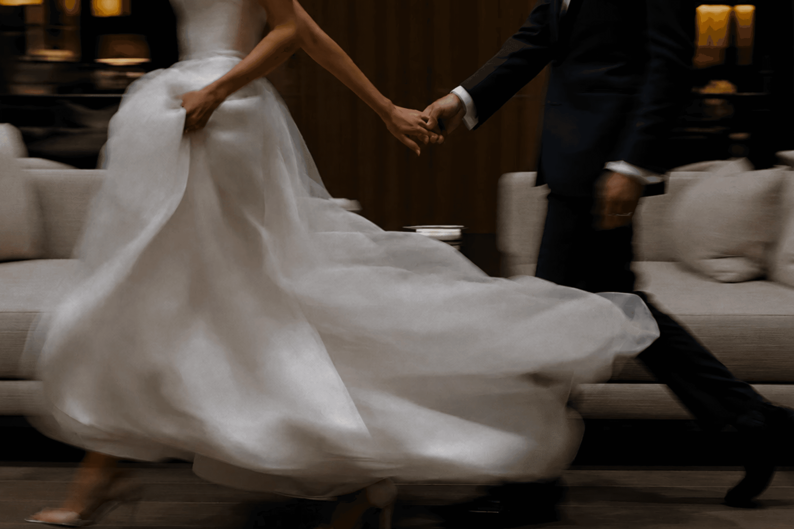 Wedding couple walking in an elegant reception hall