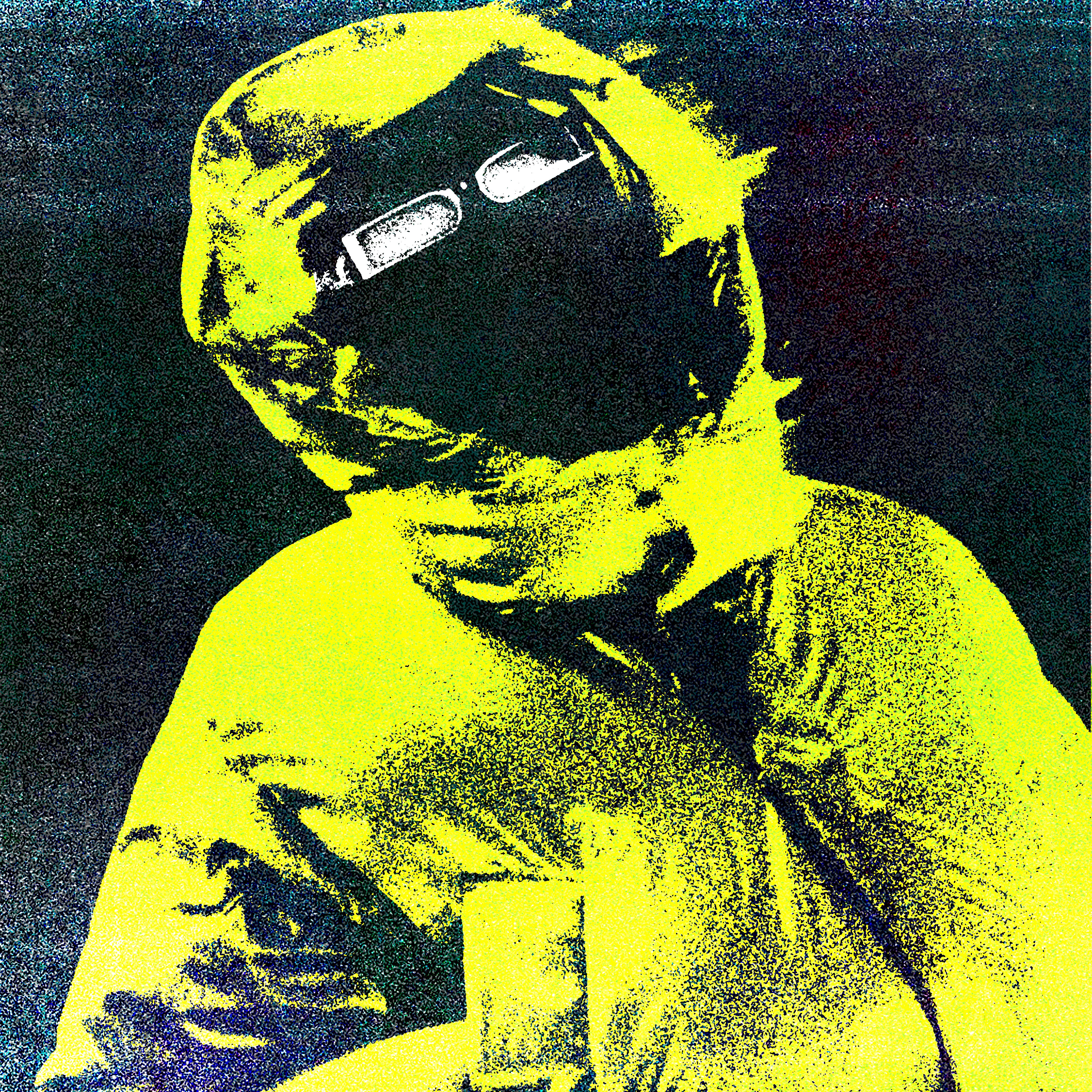 Close-up of a yellow tennis ball sitting on a green court, positioned near the white center line.