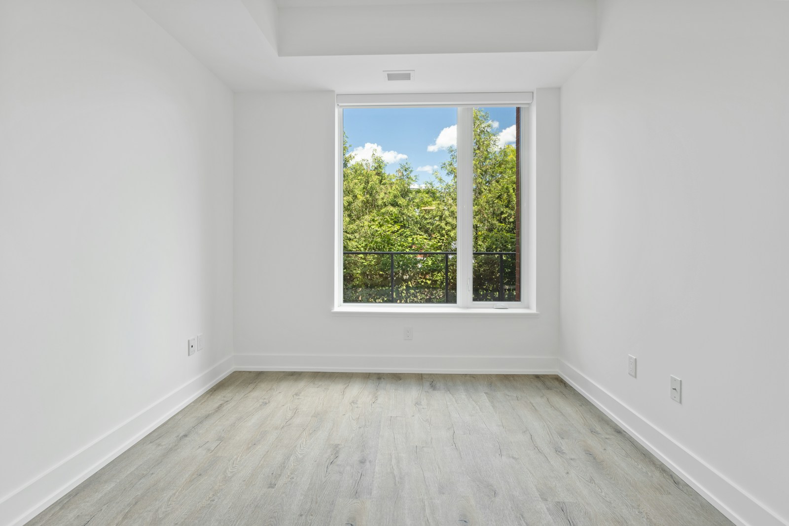 A bare room before work begins, lit from one window