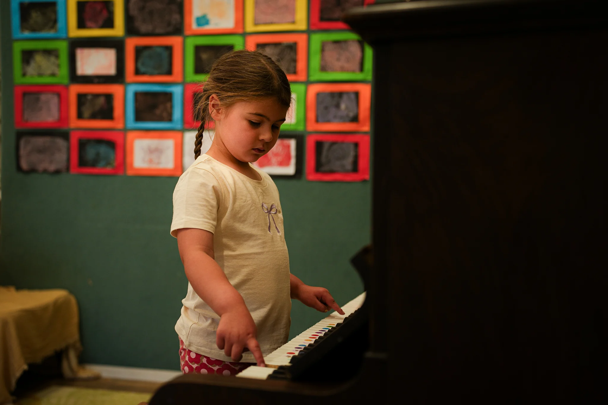 A teacher reading an illustrated book with young children during group time.