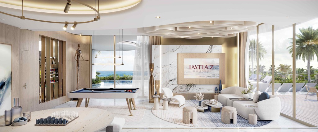 A modern living room featuring a pool table and a dining table, set in the Sunset Bay Grand.
