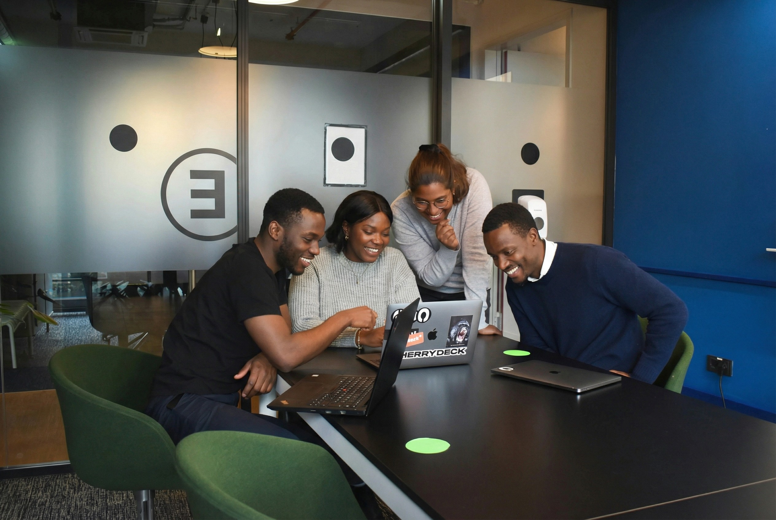 people sitting on chair in front of laptop computers