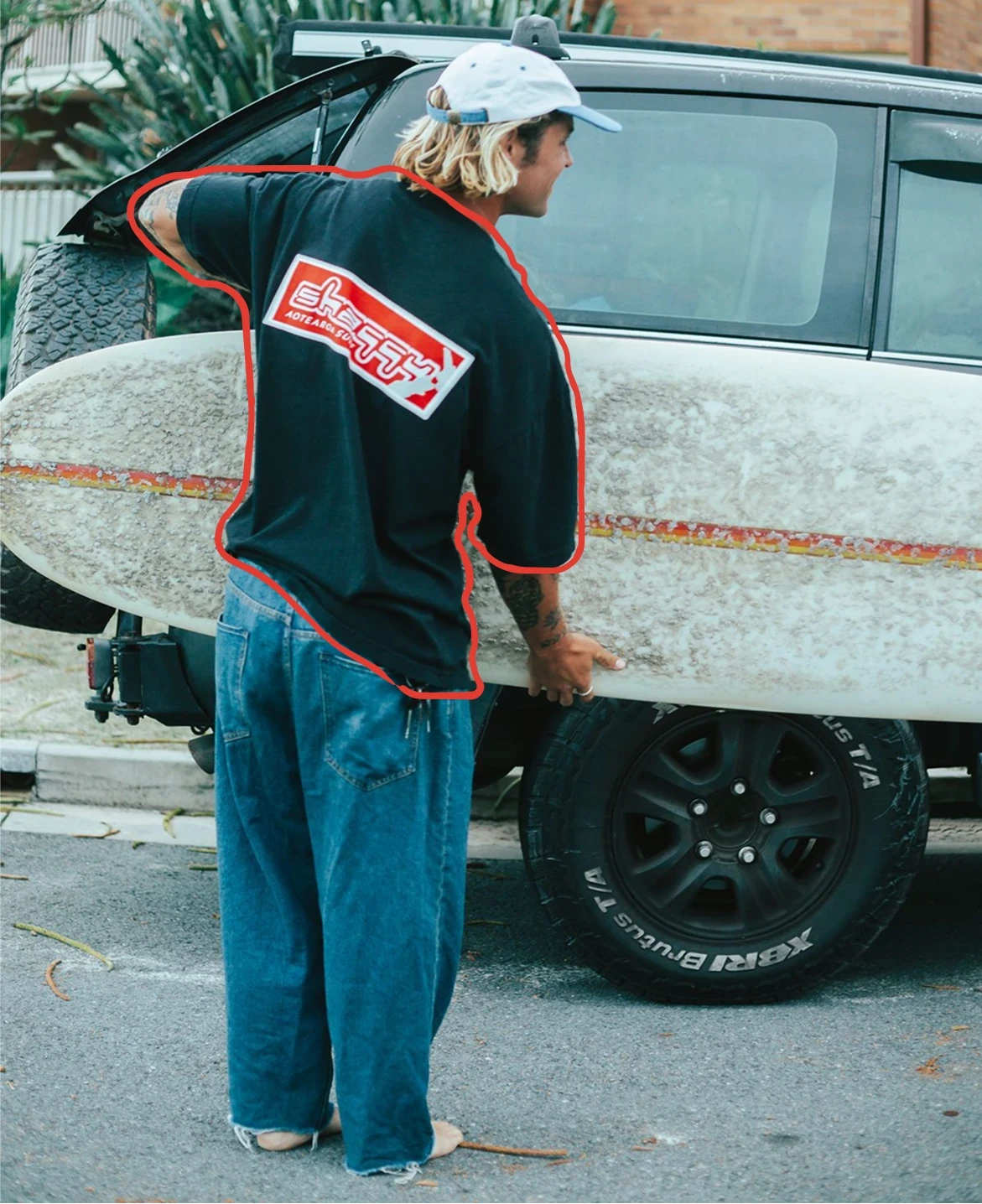 a glass of green paint next to some cards
