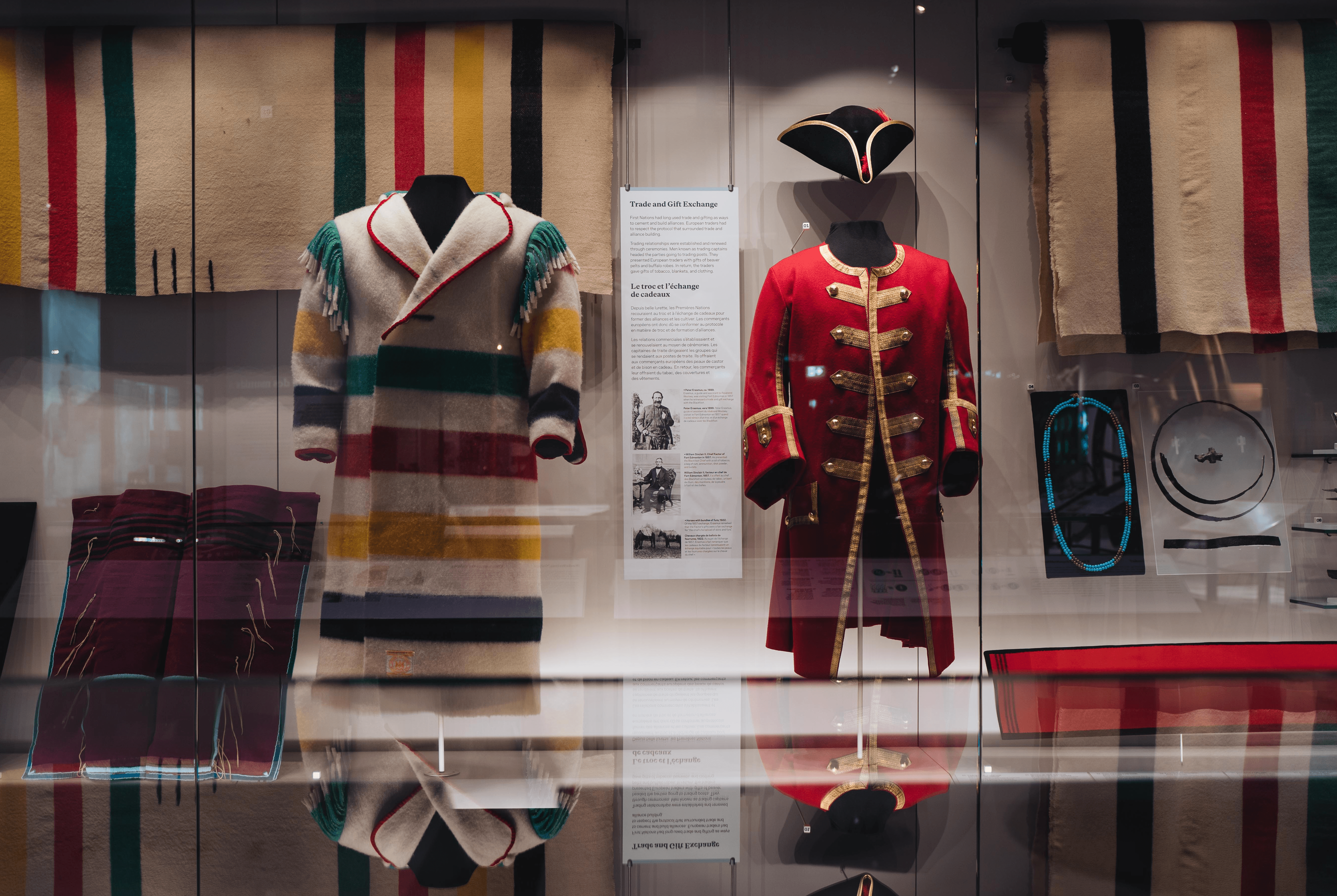 Old clothing at a museum being displayed behind glass
