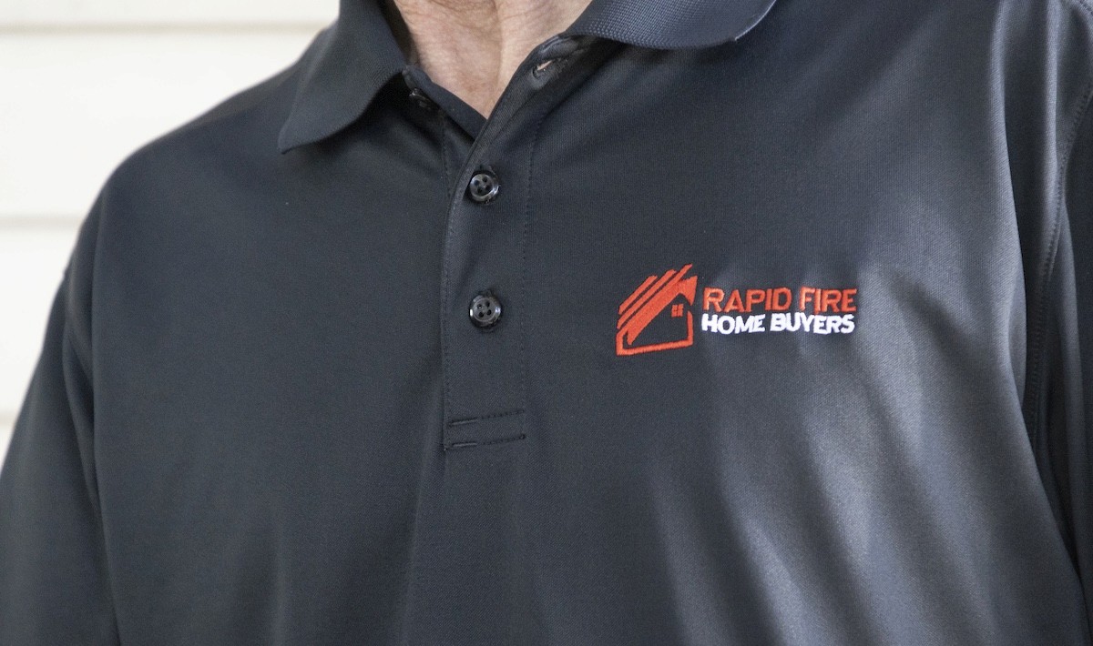 Rapid Fire Home Buyers branded polo with image that says how to spot red flags 