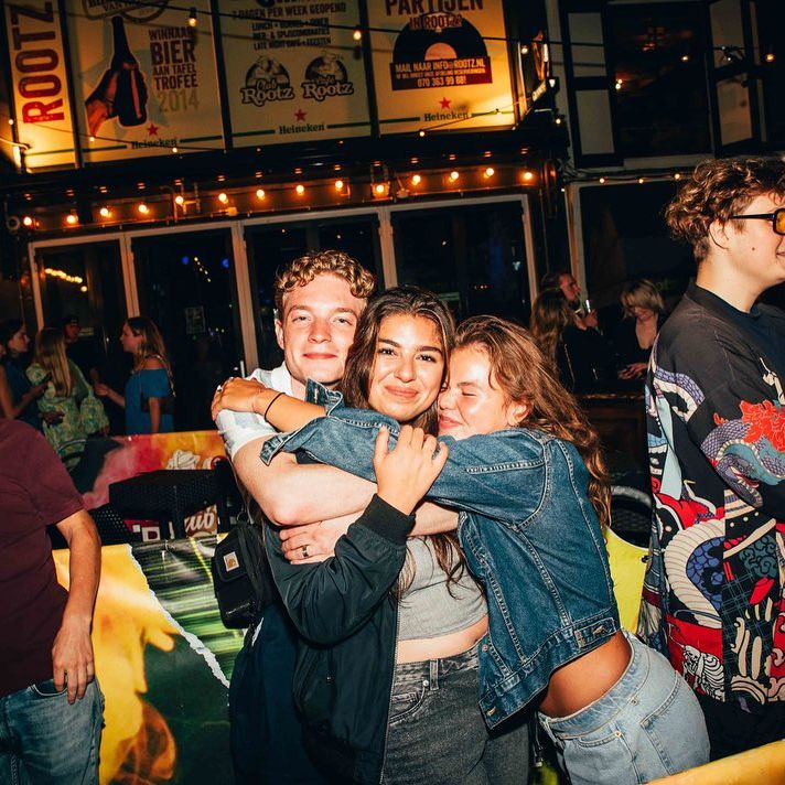woman standing in line with a ticket entering a festival