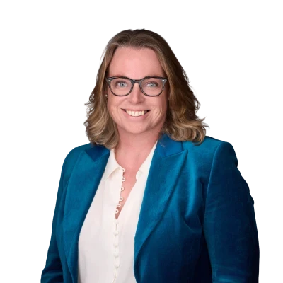 Claire McDonald from Scor smiling, dressed in a blue blazer, for hx Live 2025.