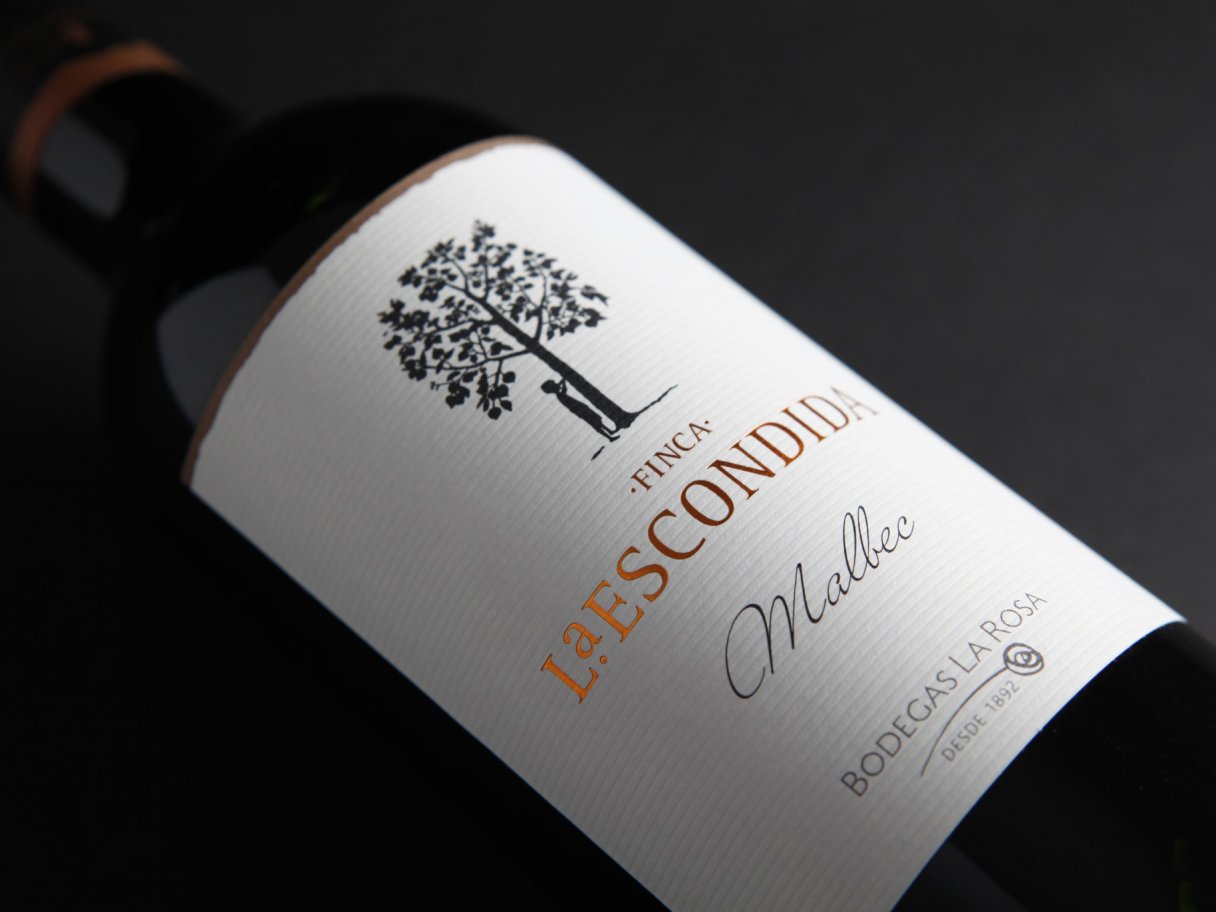 Rustic cabin in a golden field at sunset