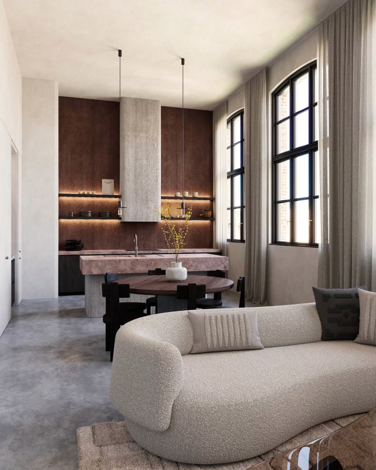 A dining and living area with a round wooden table, dark dining chairs, and plush furnishings that highlight a seamless blend of comfort and sophistication