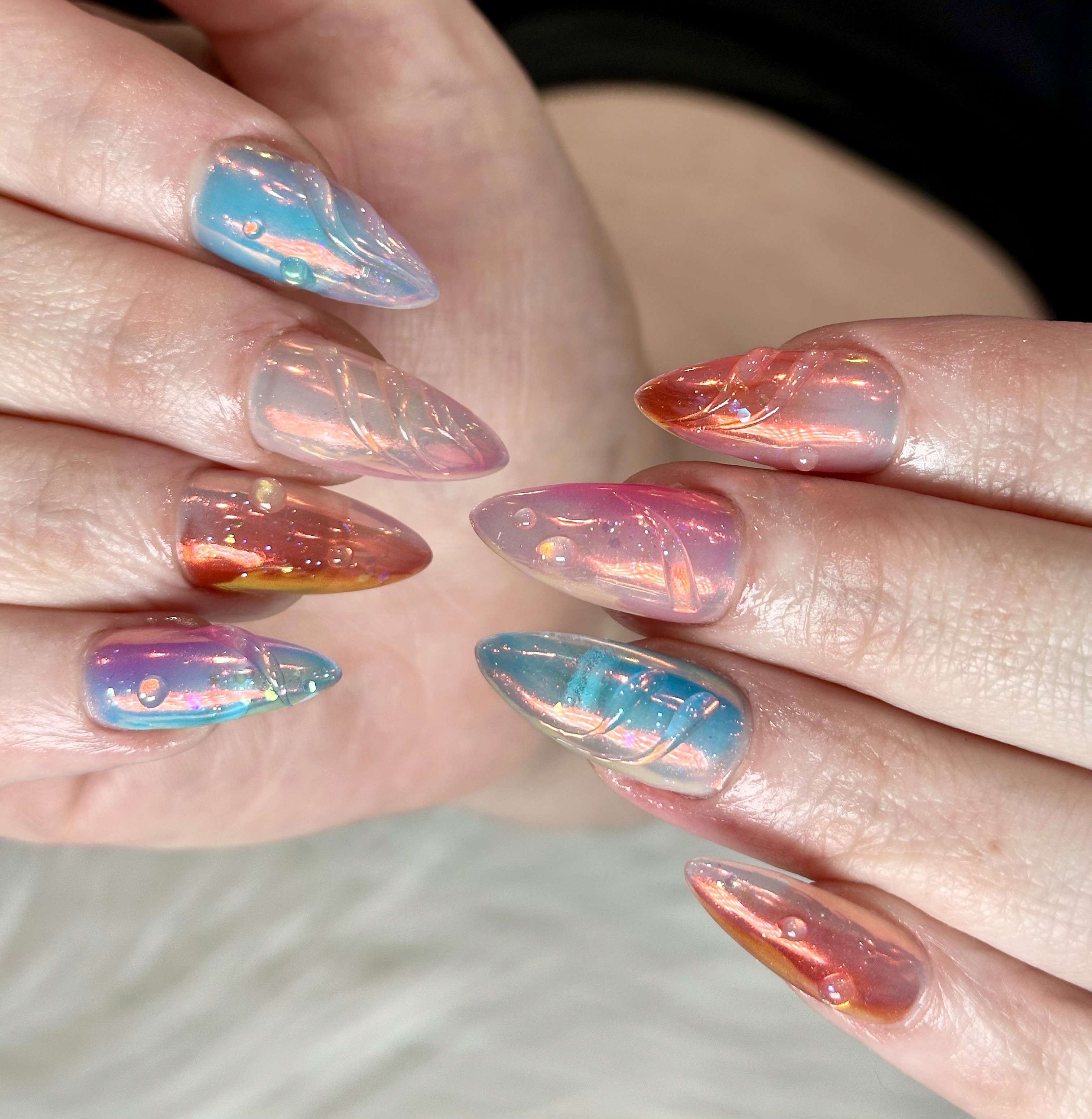 Gel-X almond nails with iridescent chrome design at luxury nail salon in Naperville IL