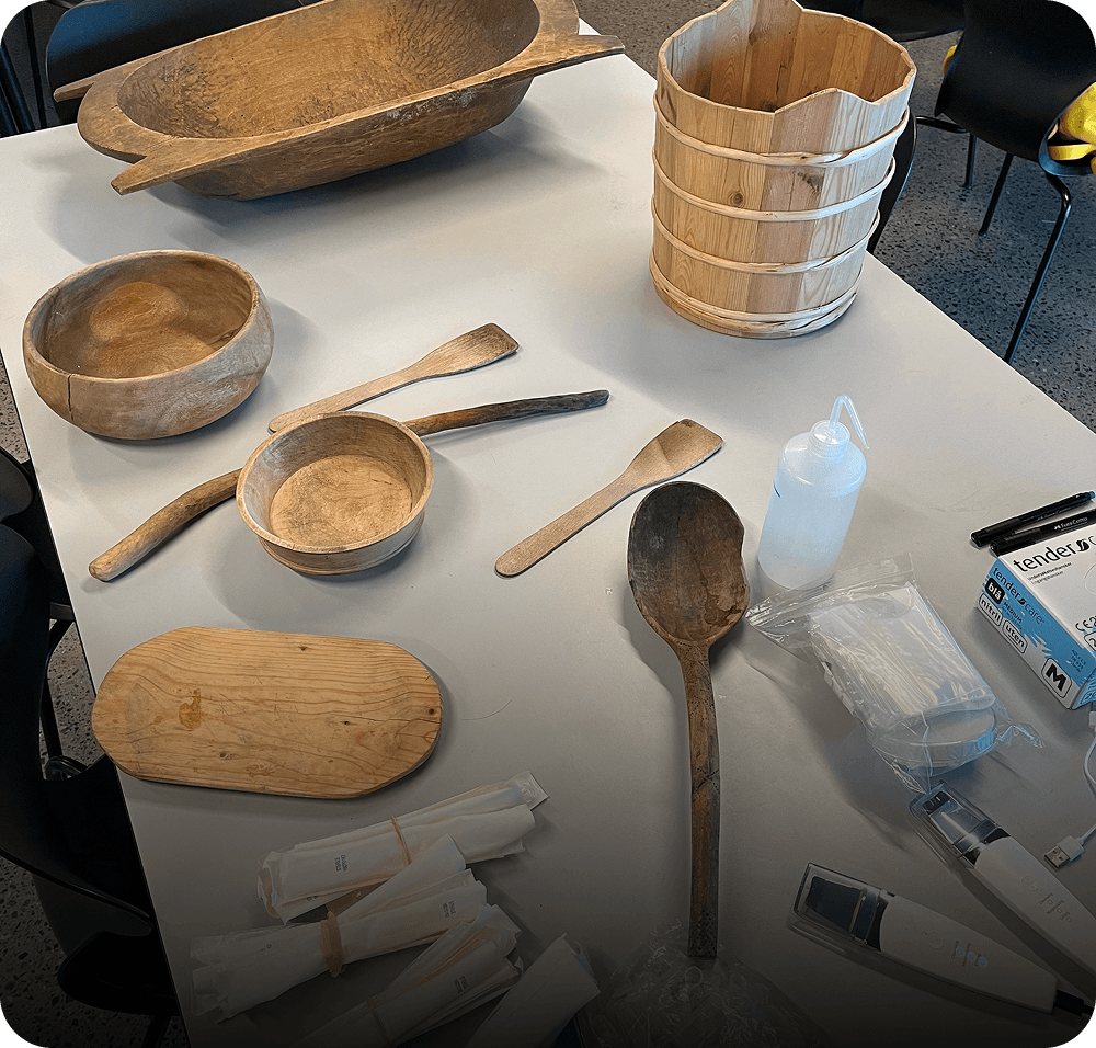 wooden bowls and spoons on a desk