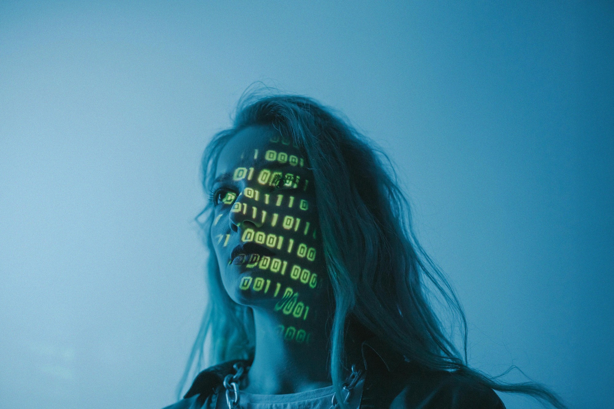 AI agents for website and business automation; illustration of artificial intelligence and digital processing projected onto a person’s face.
