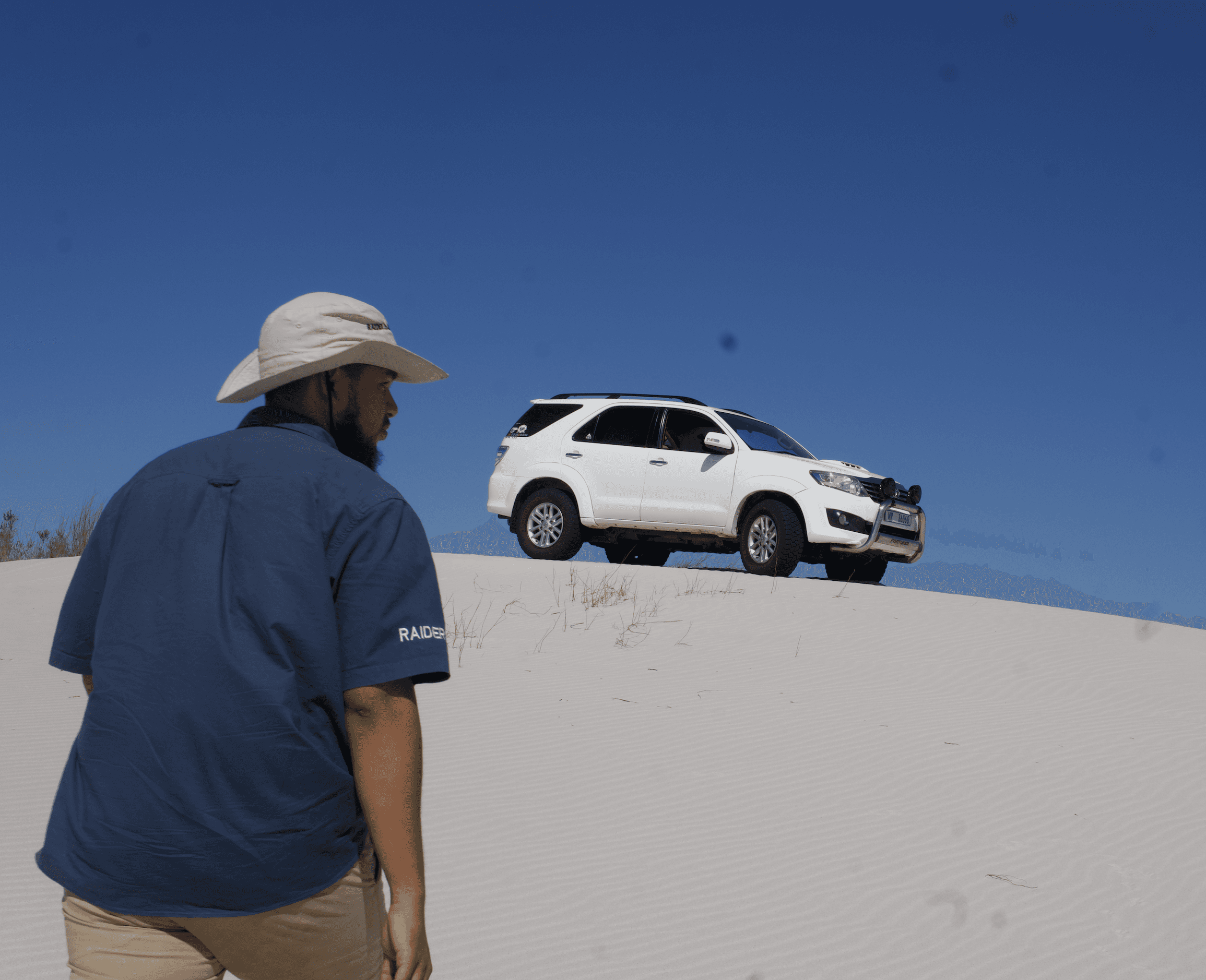 person writing on a piece of paper