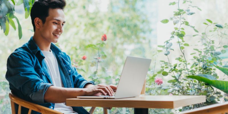 A Malaysian man using his laptop