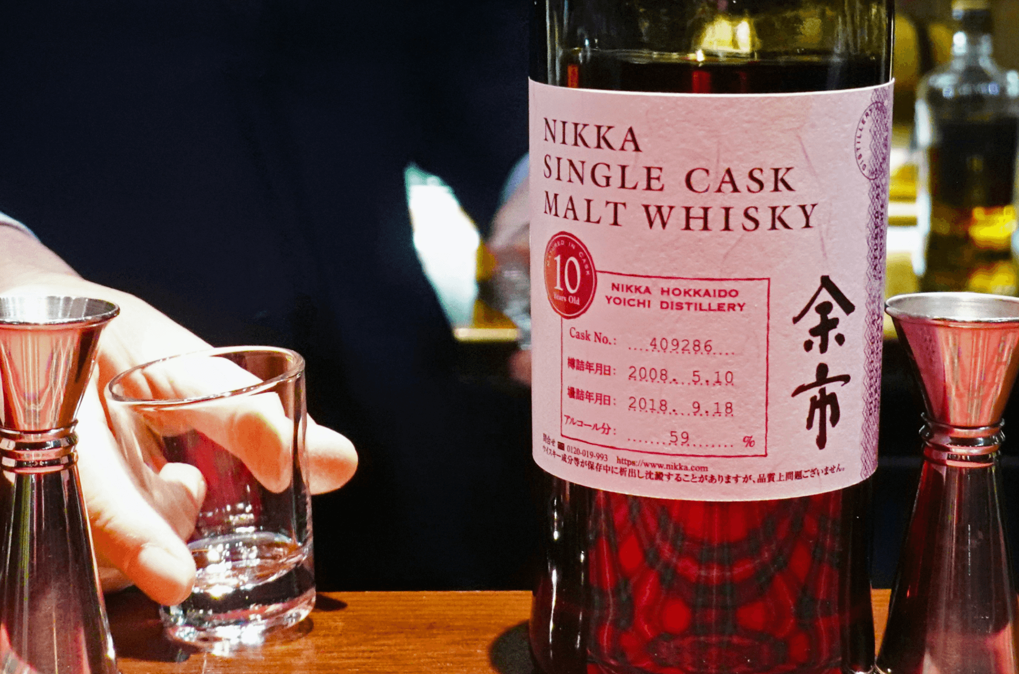 A bottle of whisky and a glass