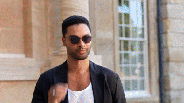 Bride in white dress walking on street, blurred motorcycle passing
