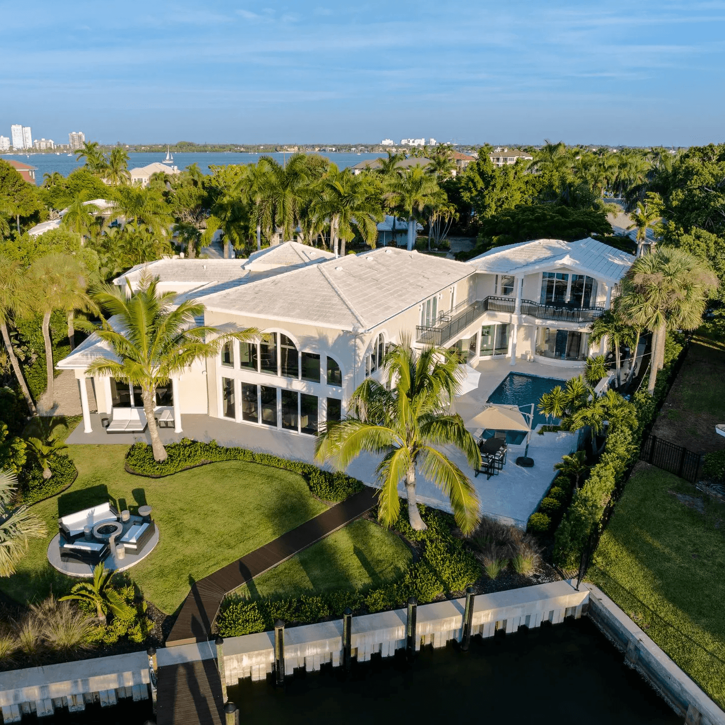 a bulldozer digging dirt in front of a house