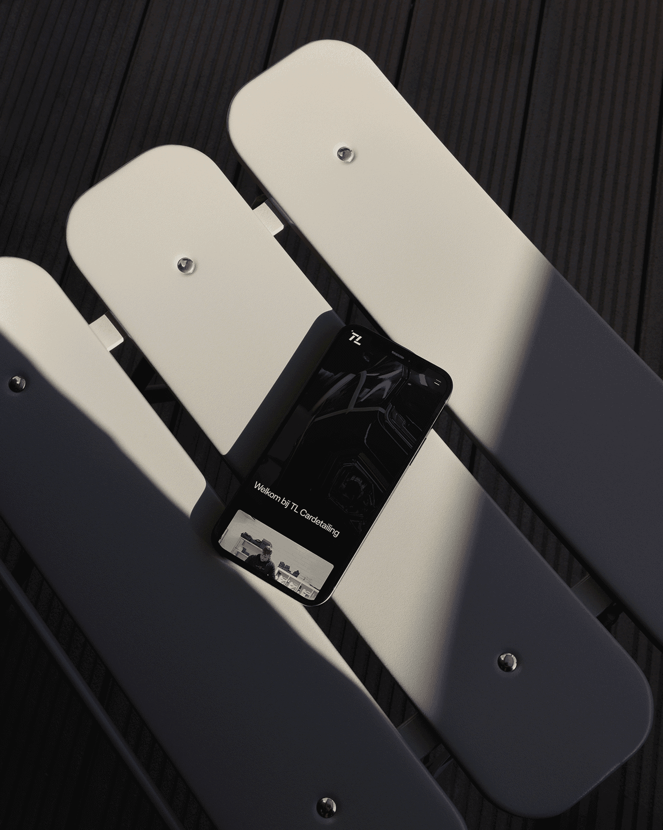 Image of a chair with a phone on it with a website open