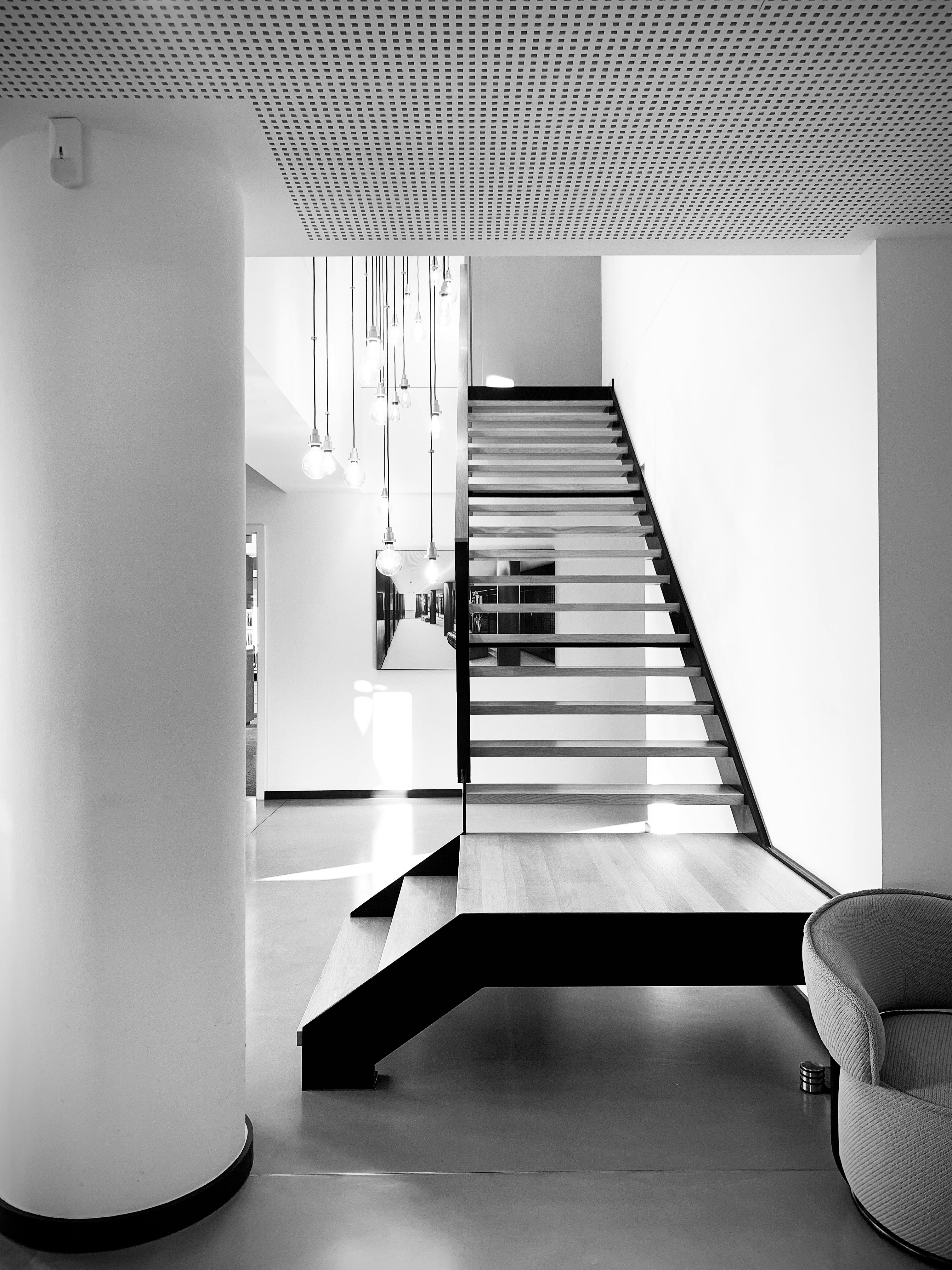 grayscale photo of staircase in building