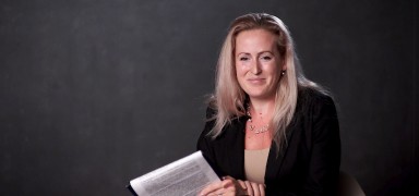 A speaker delivering a presentation at the conference.