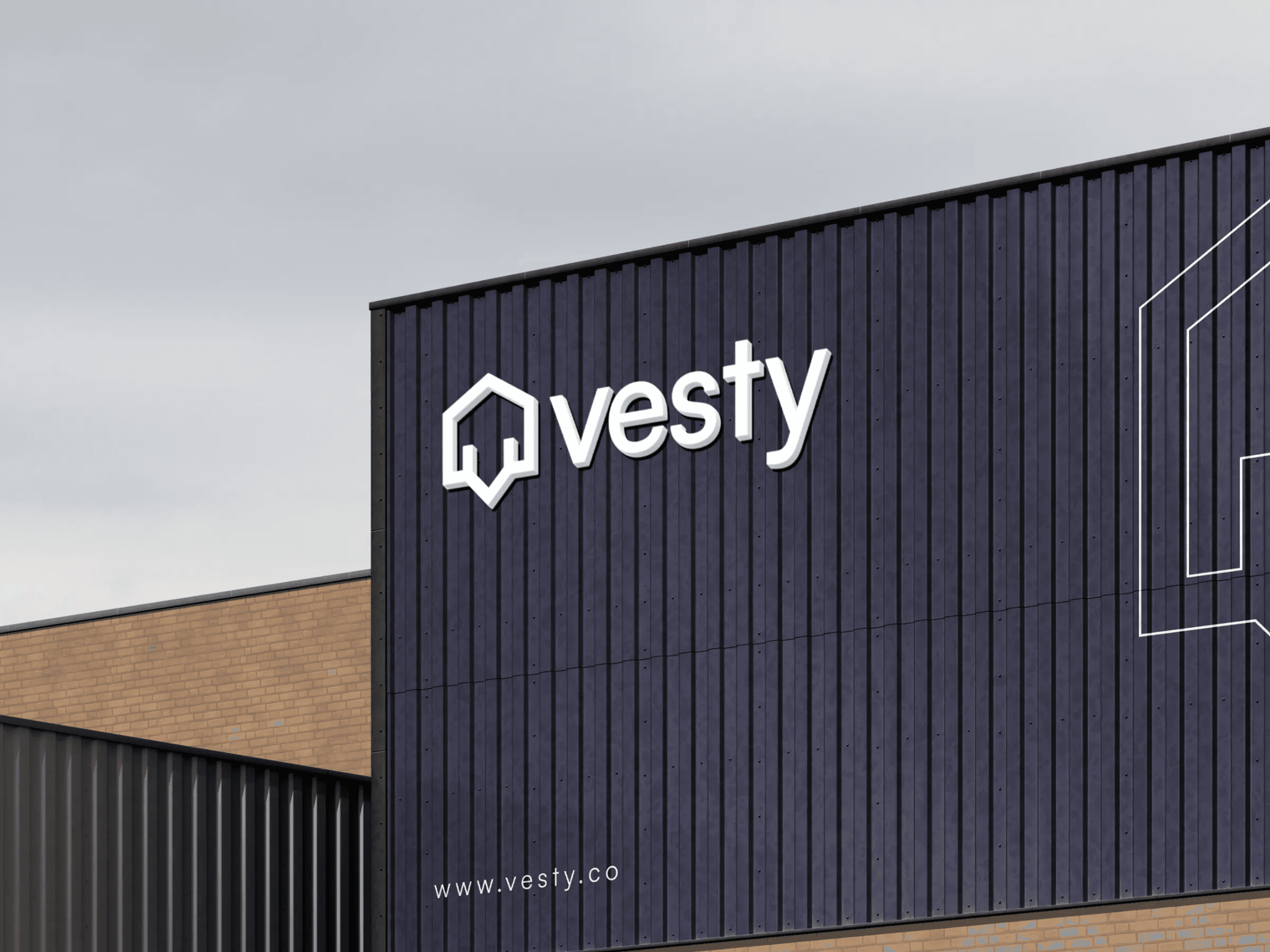 Modern building facade with 'vesty' logo and website URL in white on dark panels