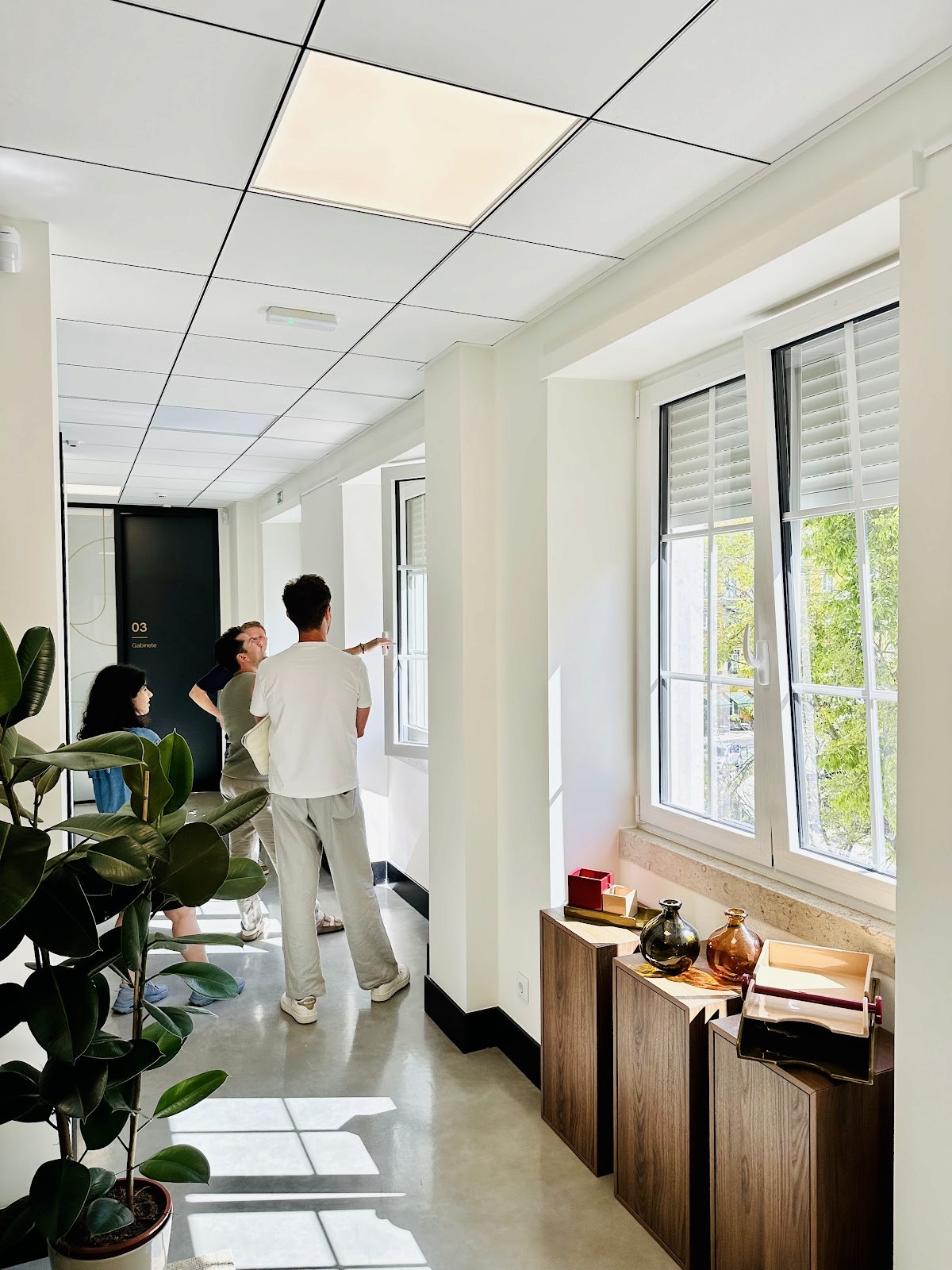 Members walking through the TejoMed clinic hallway