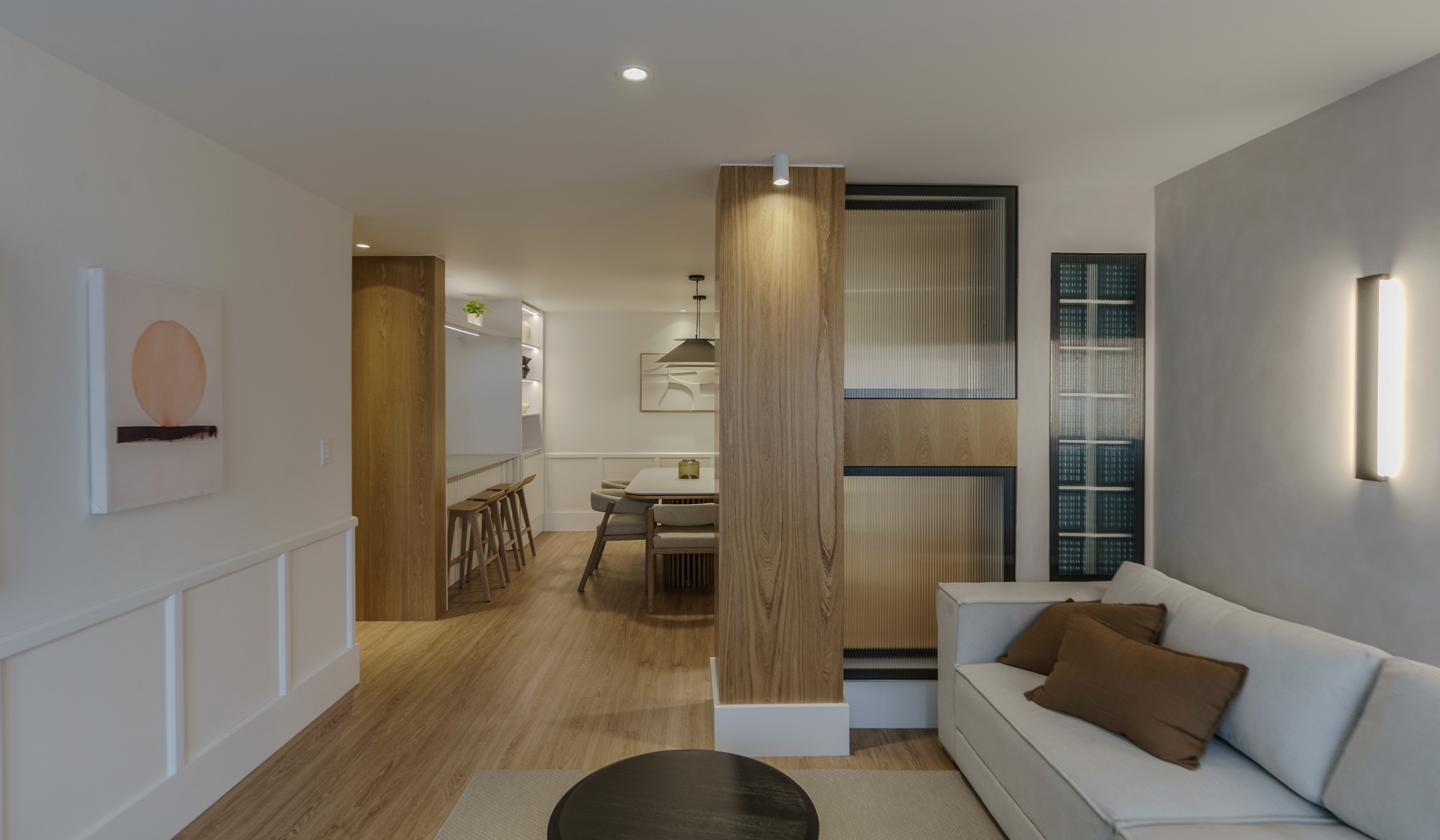 Double-height interior with flowing sculptural forms and warm raking light