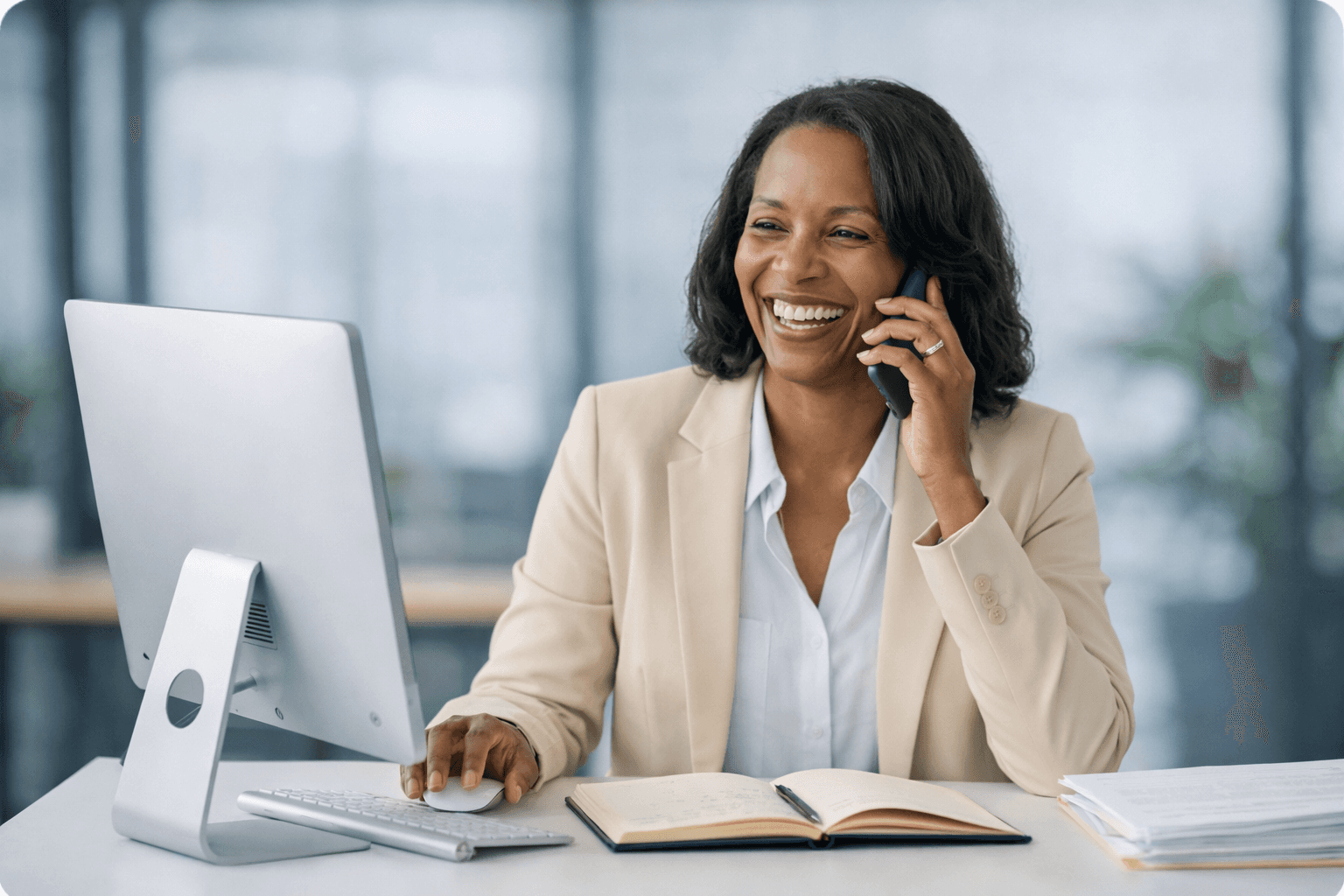 Profile image of LinkedPhone customer - african american woman working at computer on a business call
