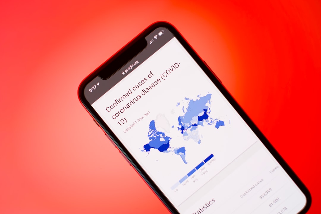 black samsung android smartphone on red surface