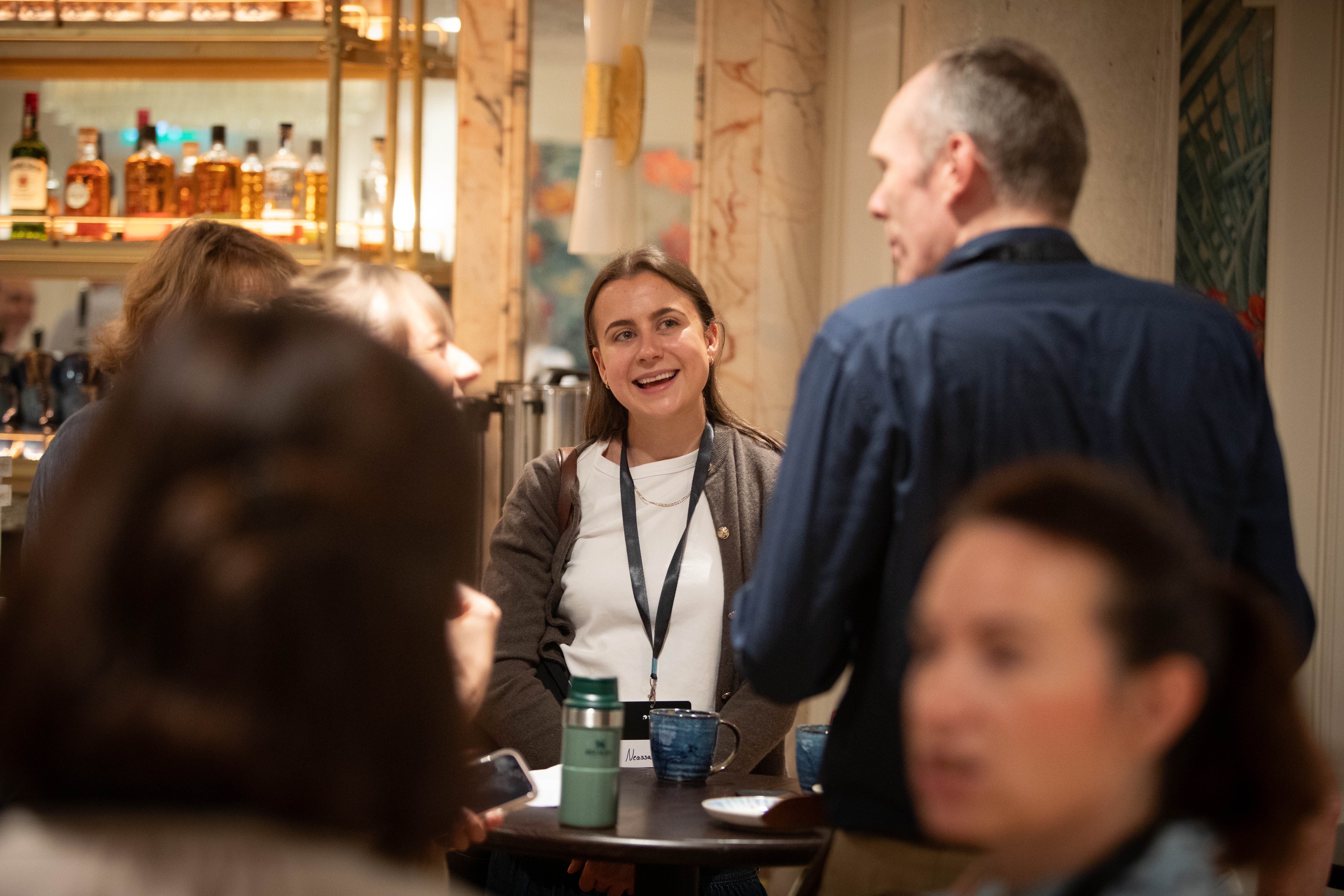 Attendees in discussion during the Talio event