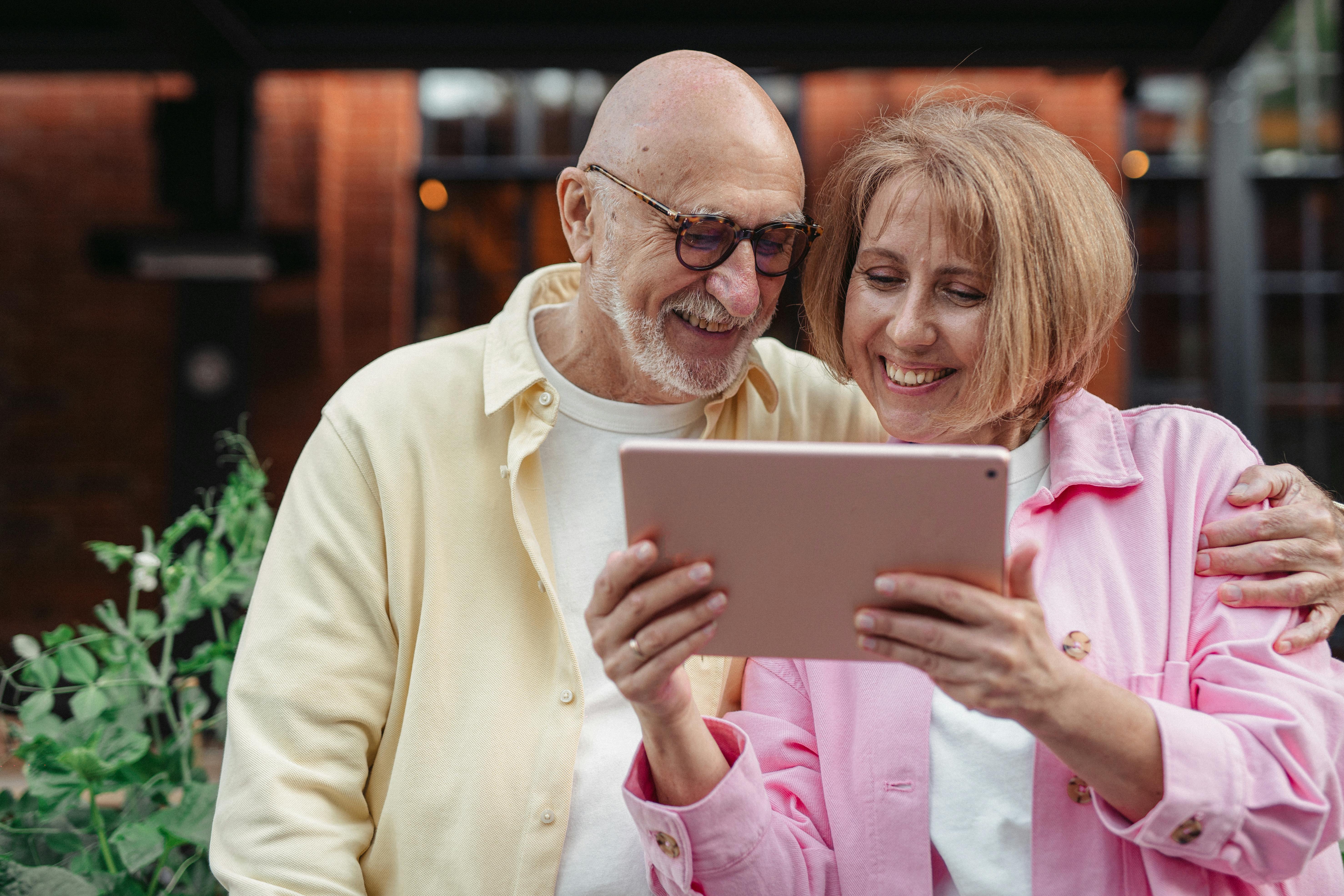 Happy family using tablet on private jet