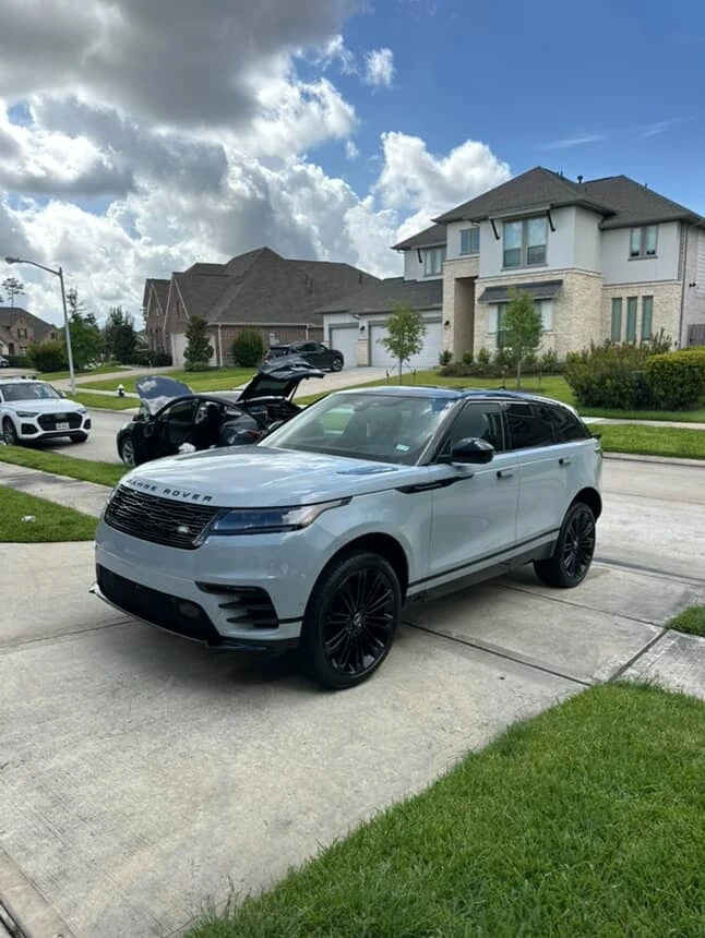Light grey Range Rover Velar with black rims after a full exterior detail and wax in Houston.