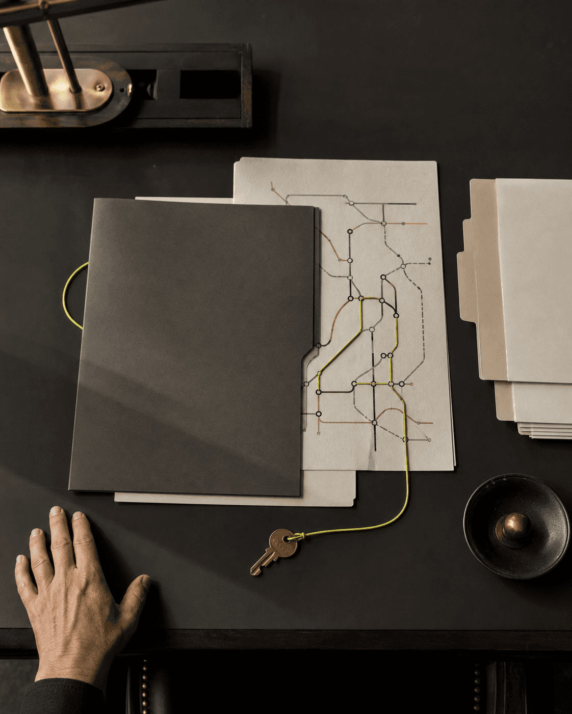 A public-service folder, map, and route markers arranged for program navigation.