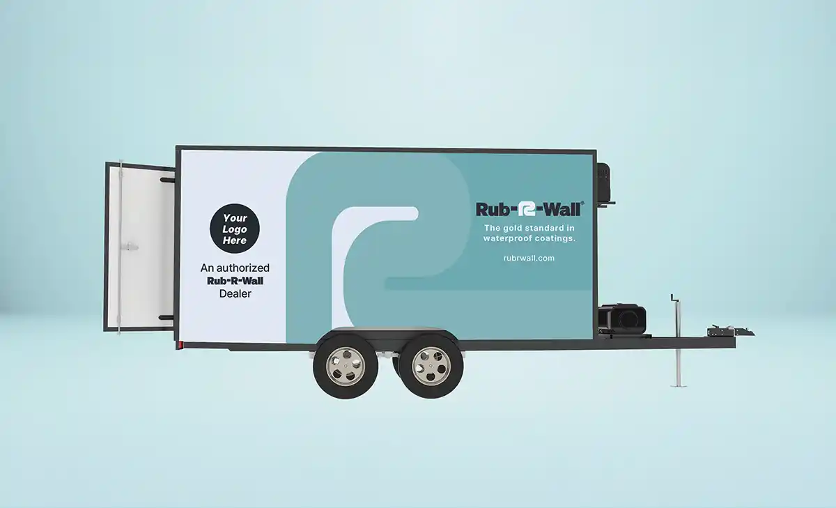 A Rub-R-Wall waterproofing trailer with the Rub-R-Wall logo on it along with space for an individual applicator logo