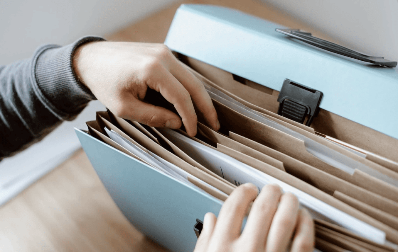 person going through paper documents